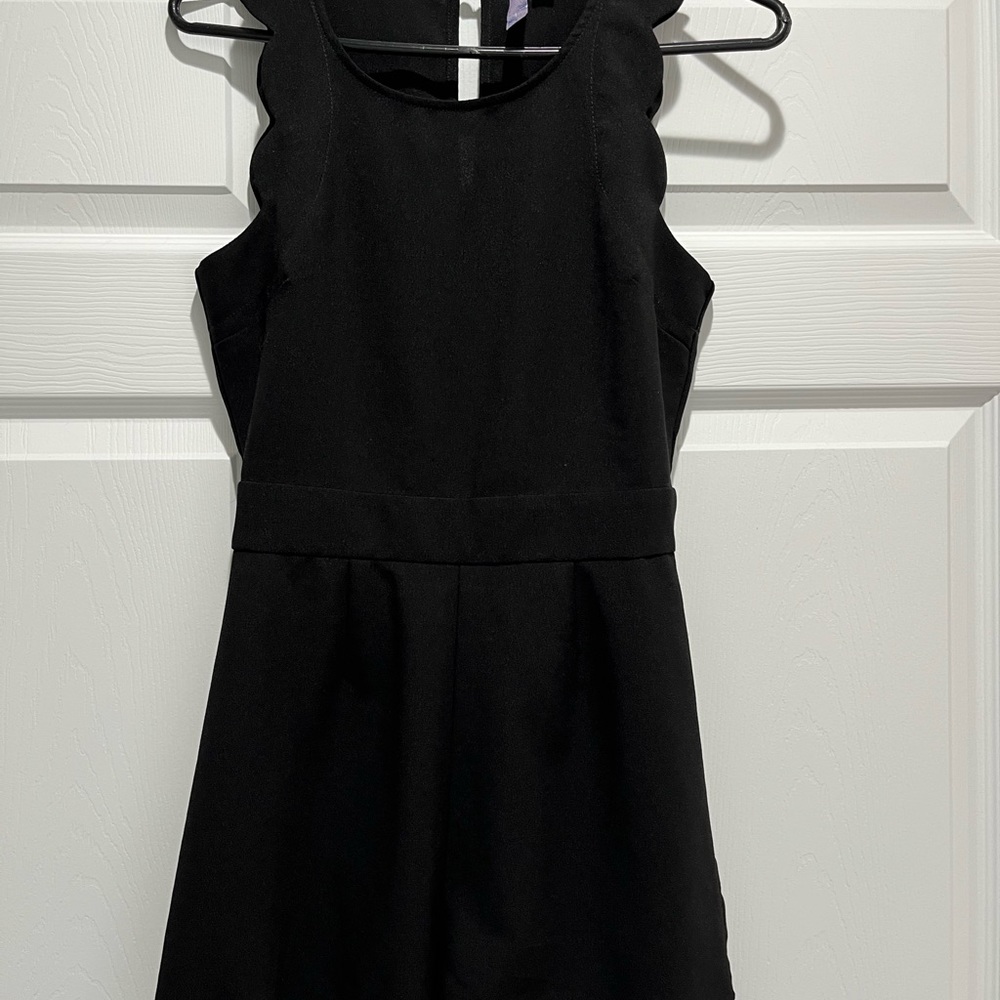 Black romper with scalloped edges.  Size small.